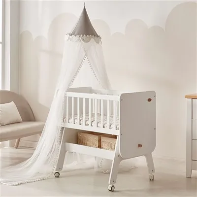 Cuna mecedora de madera